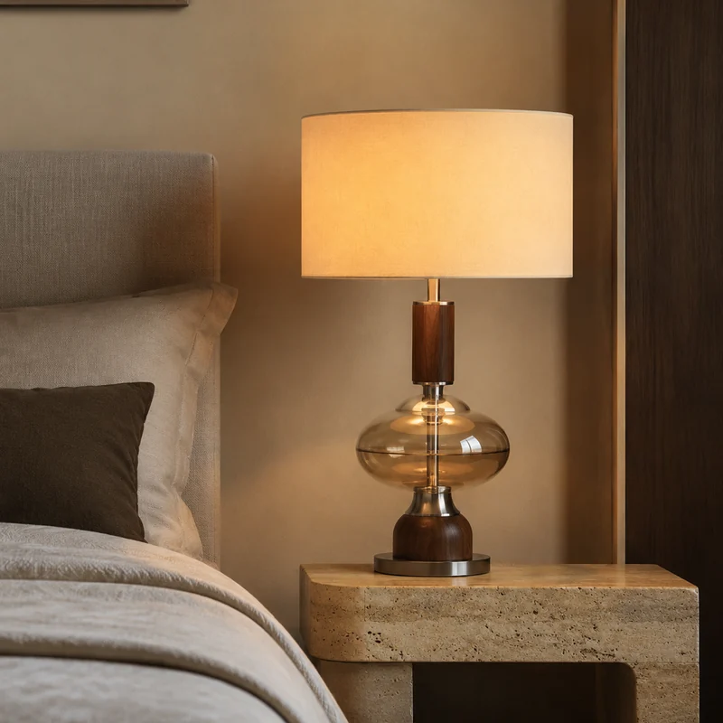 Table lamp beside a refined bed