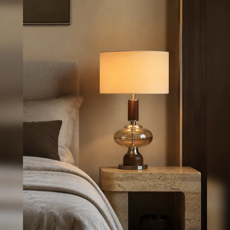 Table lamp beside a refined bed