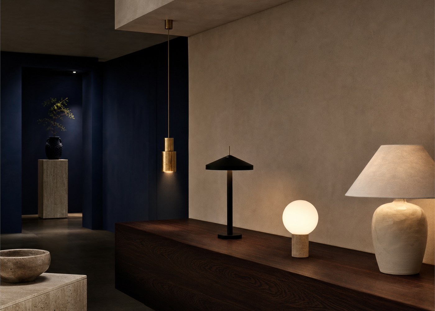 A curated study of brass, dark metal, opal glass and ceramic finishes