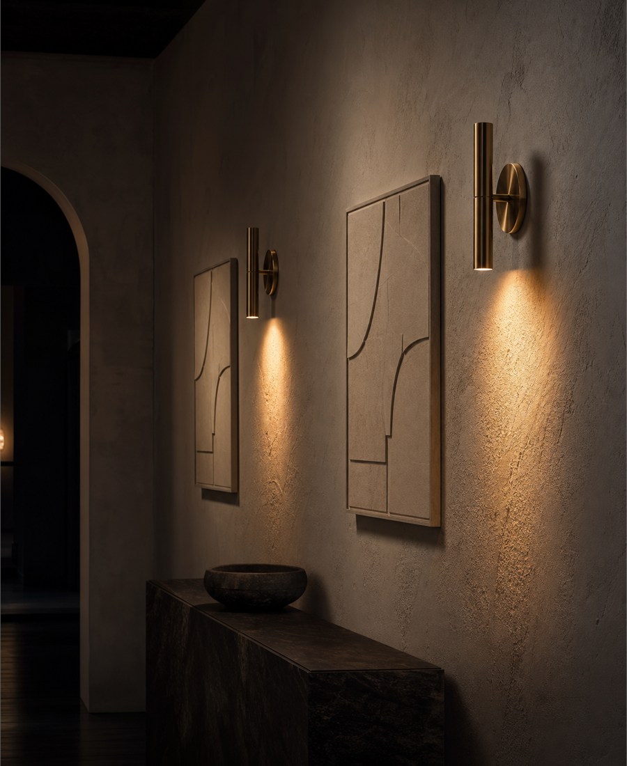 Textured gallery wall revealed by accent light