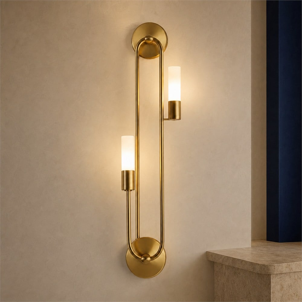 Sculpted brass wall light in an ivory alcove