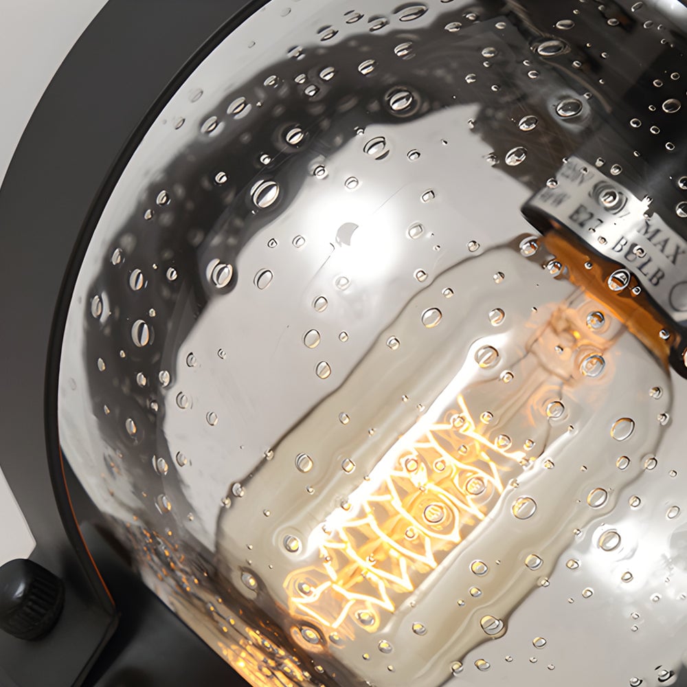 1-Light Seeded Glass Globe LED Outdoor Wall Lantern with Curved Arm - Lumpaz