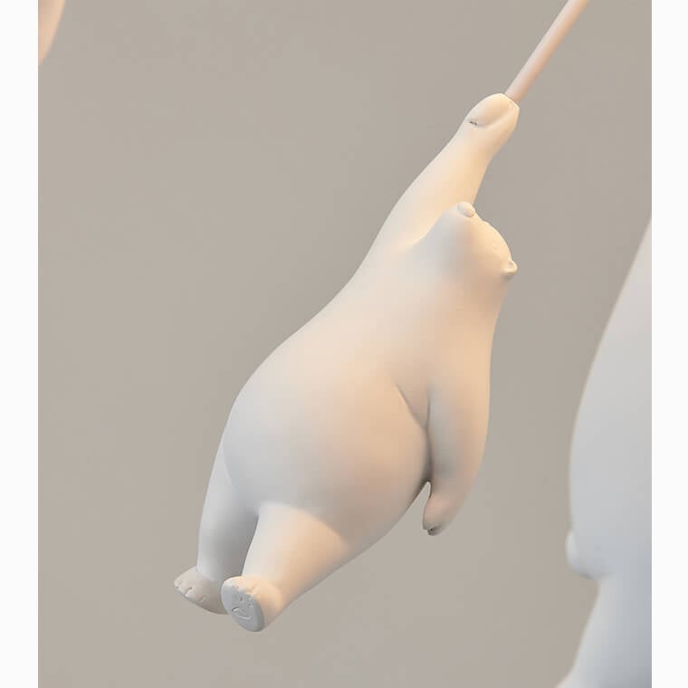 Suspended white bear figure close-up