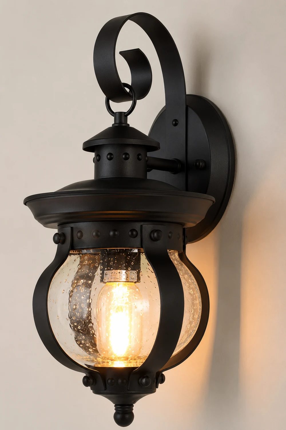 1-Light Seeded Glass Globe LED Outdoor Wall Lantern with Curved Arm - Lumpaz