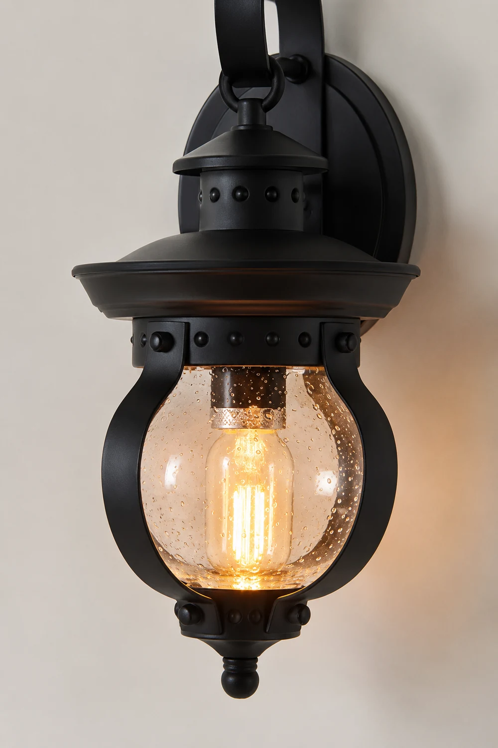 1-Light Seeded Glass Globe LED Outdoor Wall Lantern with Curved Arm - Lumpaz