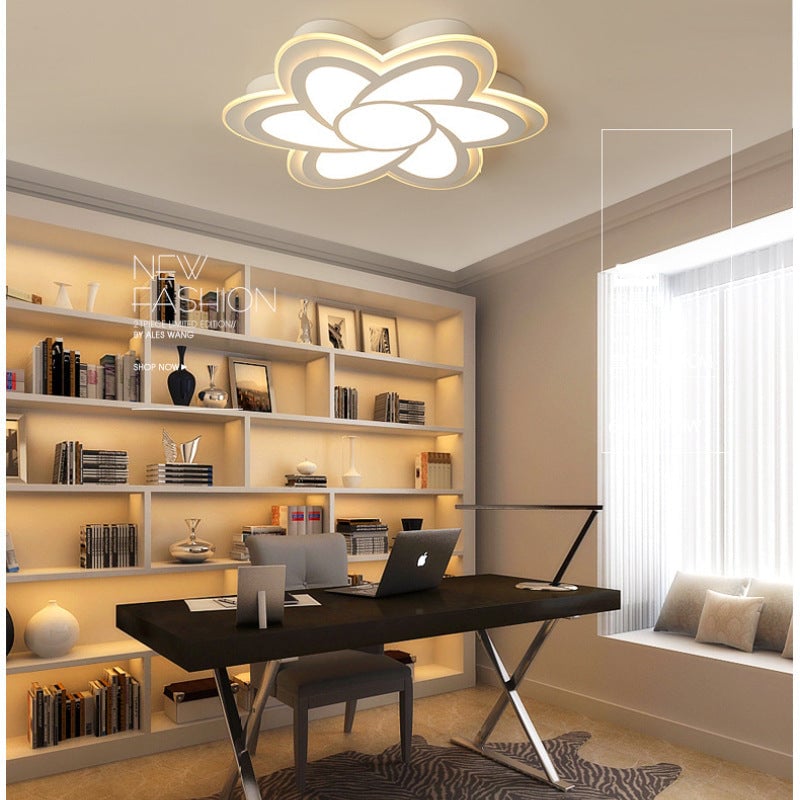 Wider study view of the Hana flower ceiling light beside a window and bookshelves