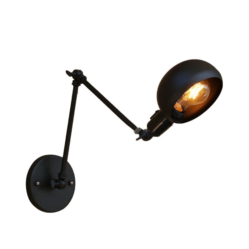 Close view of the round wall plate, adjustable joints and black shade