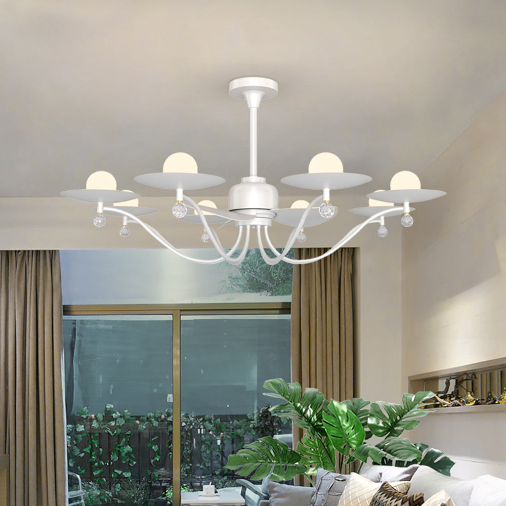 White eight-light fan fixture in a room with large windows