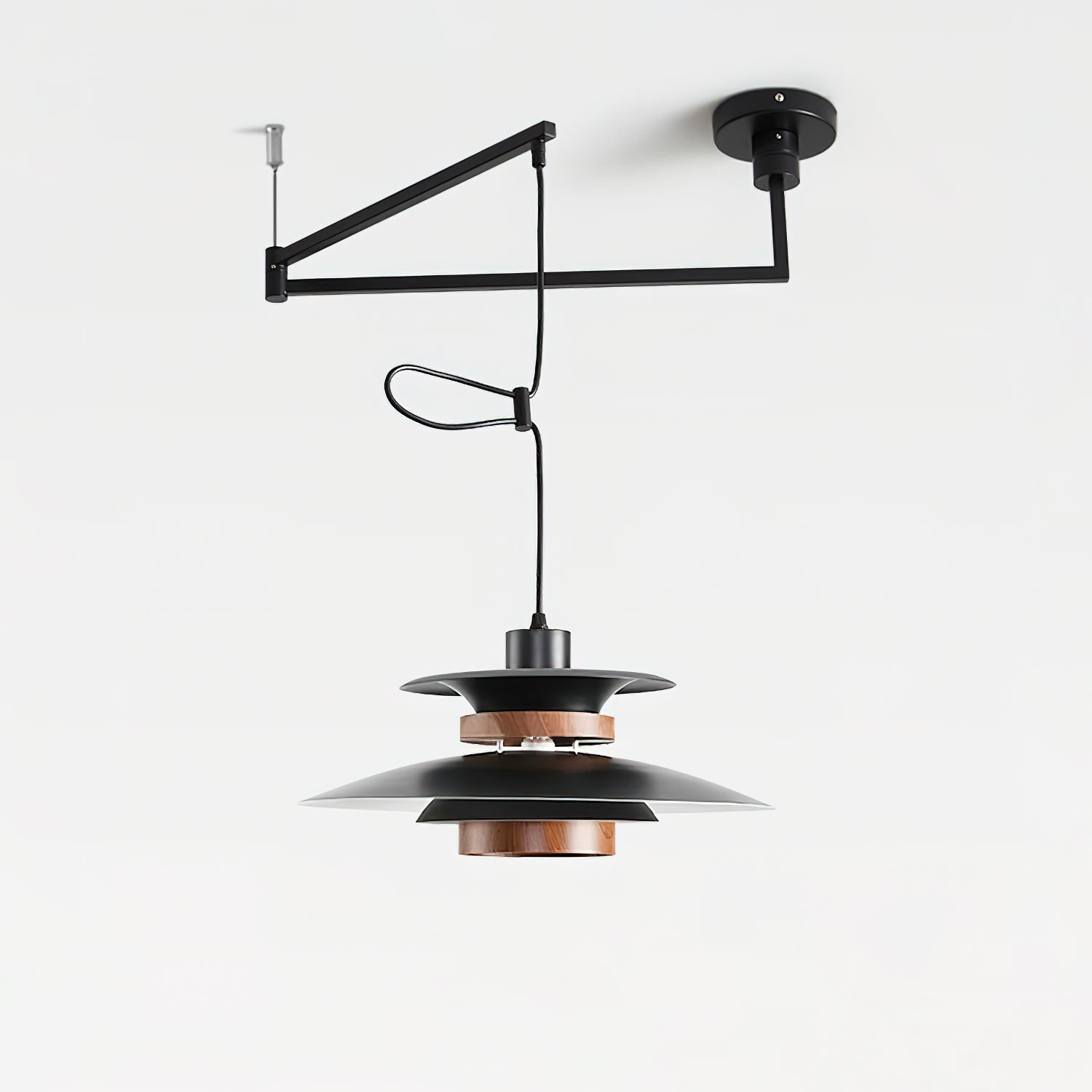 Angled product view of the black Mercero arm, cord loop and layered shade