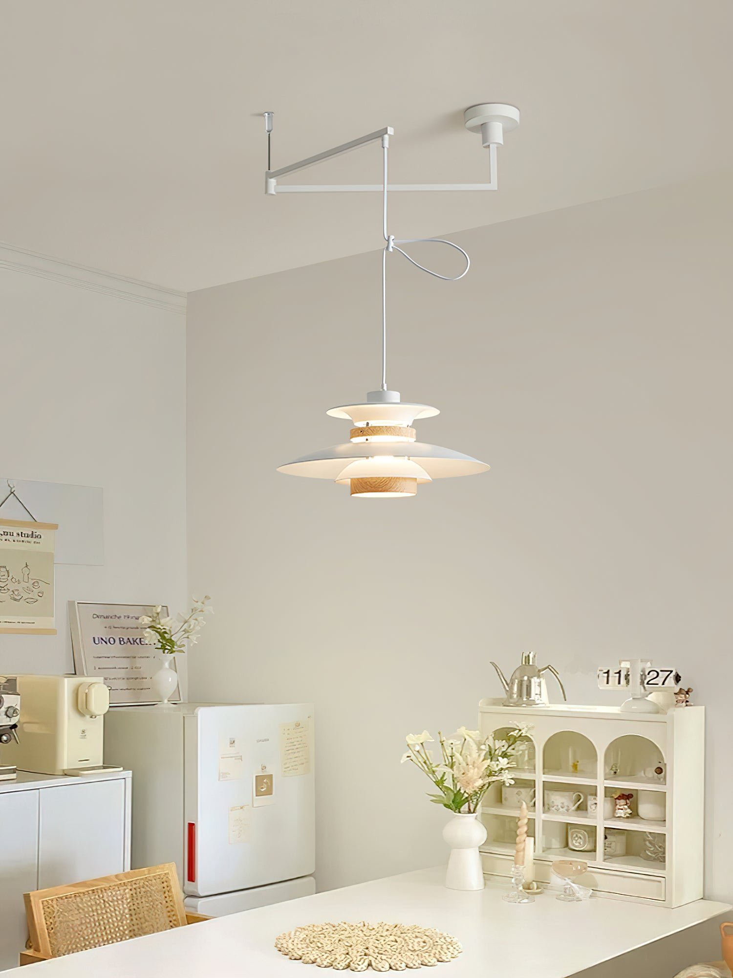 White Mercero pendant and ceiling arm in a bright room