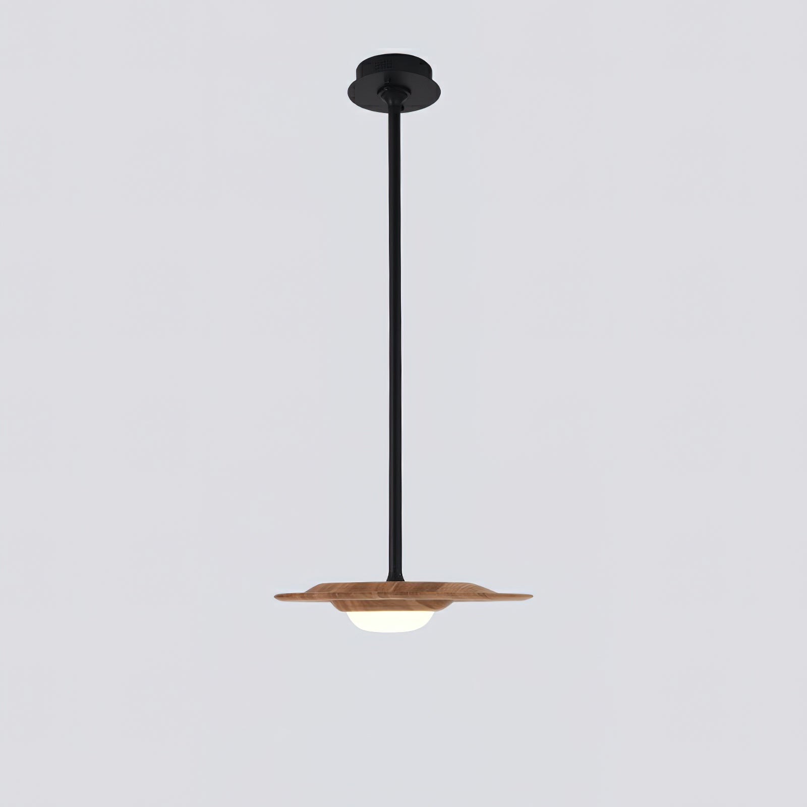Single light wood-grain pendant with white domed diffuser, black rod and round black ceiling canopy on grey