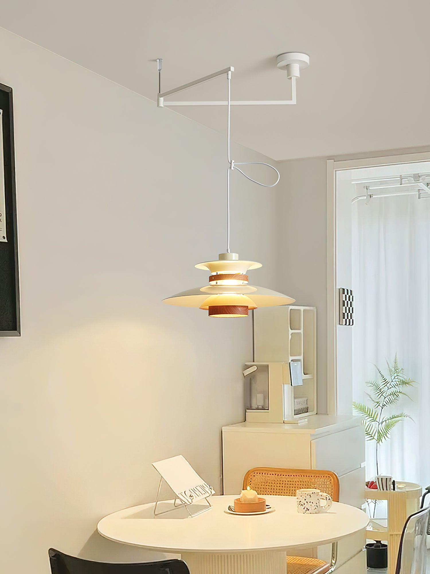 White & Walnut wood Mercero pendant illuminated in a room