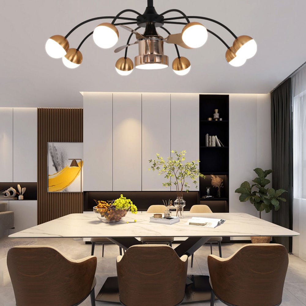 Valentina globe fan light above a dining table, with the outer globes and central lower diffuser illuminated