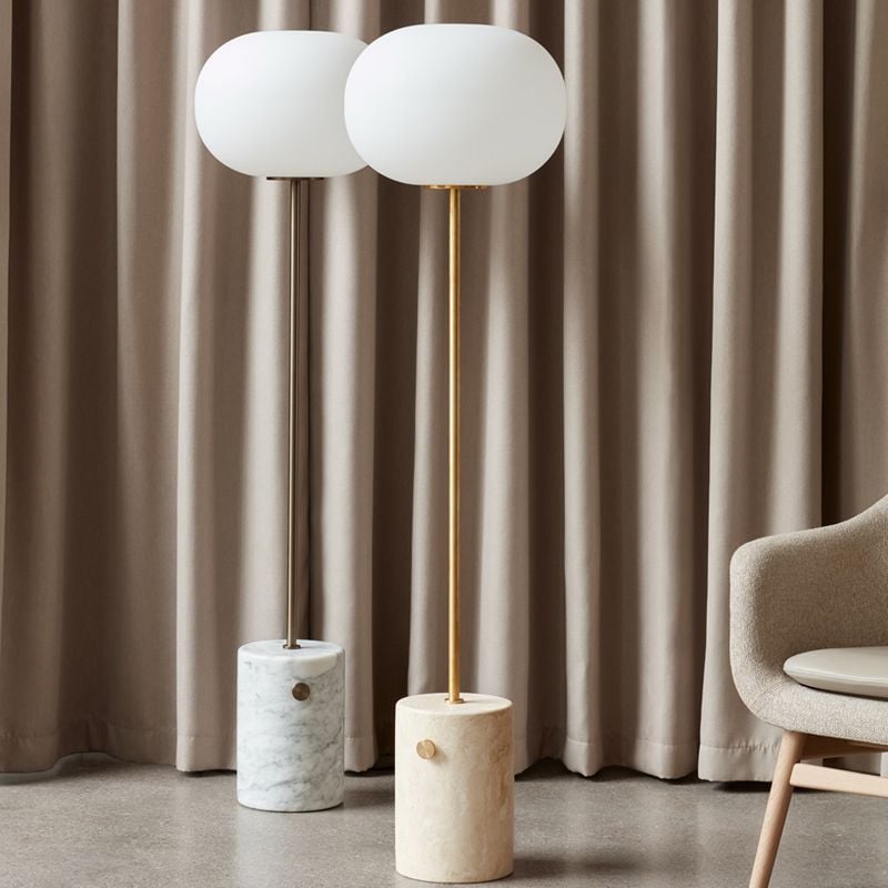 Black and brass-colored Valentina lamps shown together
