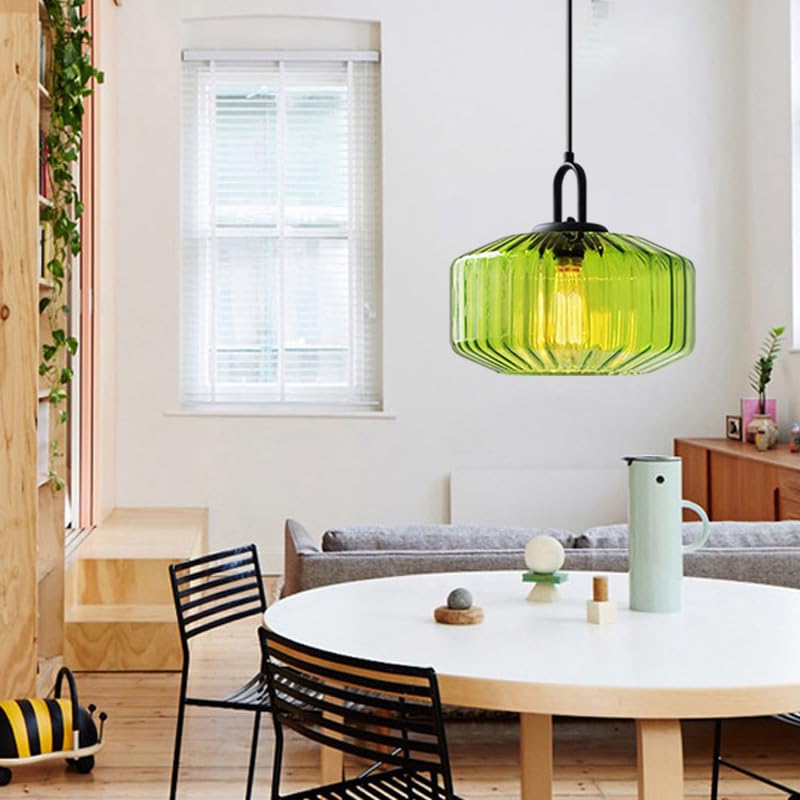 Green pendant above a round dining table