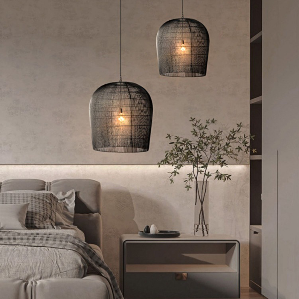 Two Black woven rattan pendants beside a bed