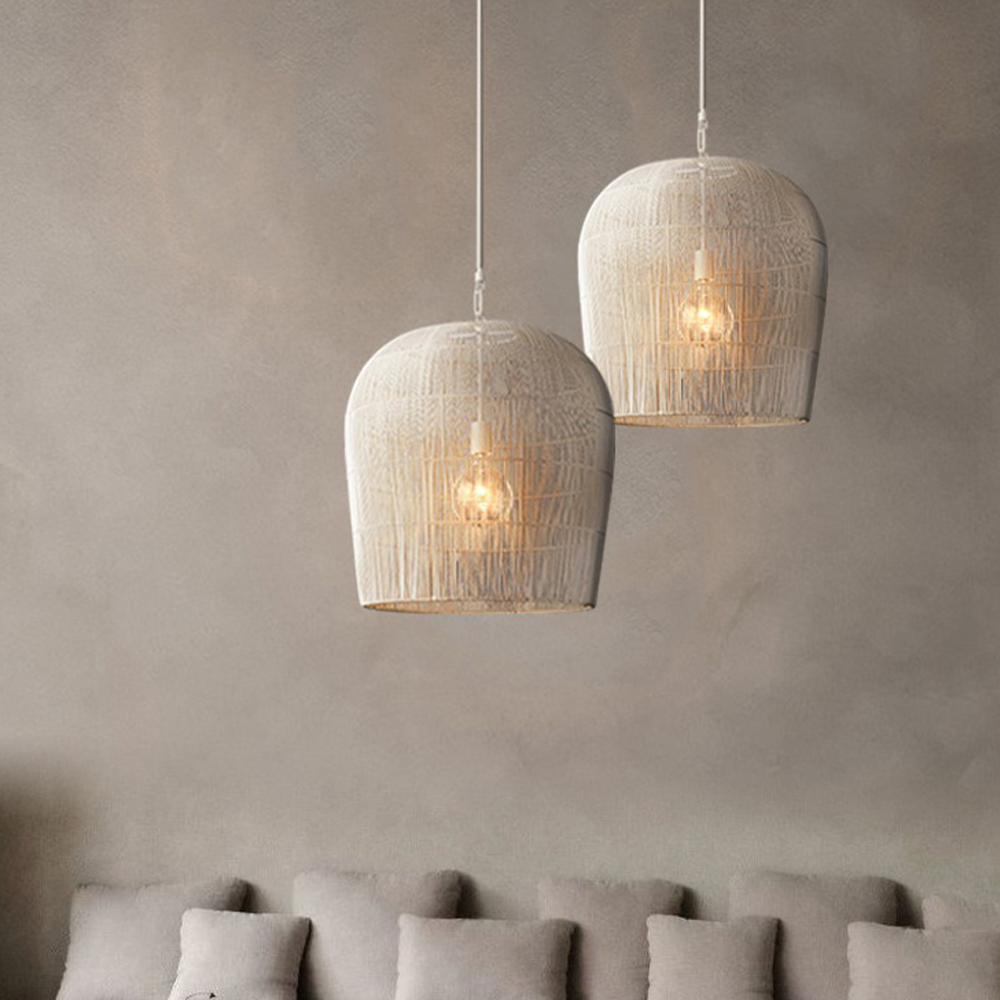 Two White rattan pendants above a sofa