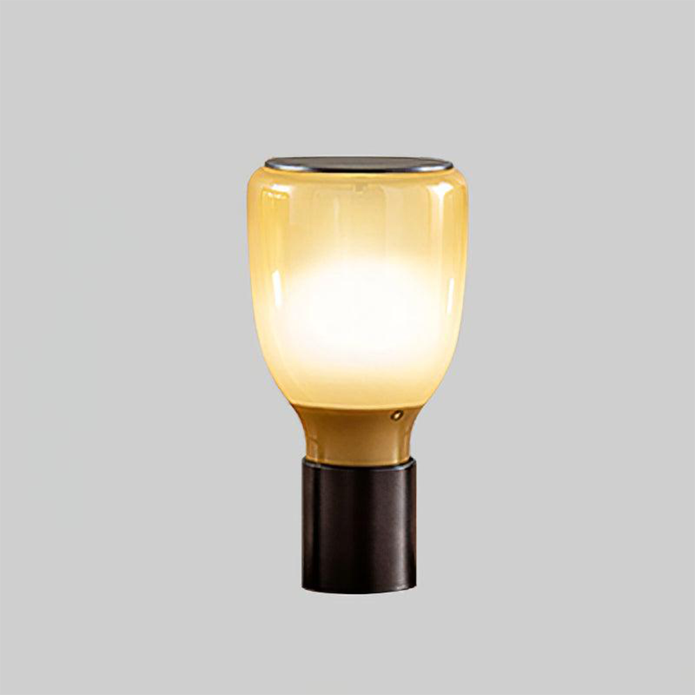 Gradient Yellow glass lamp with yellow upper body, pale centre and amber-toned neck above a black base