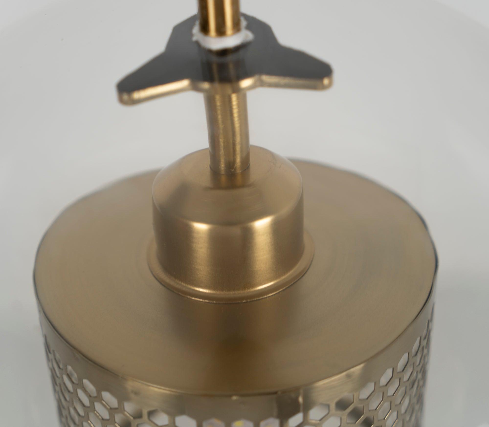 Close-up of metal support above the perforated cylinder