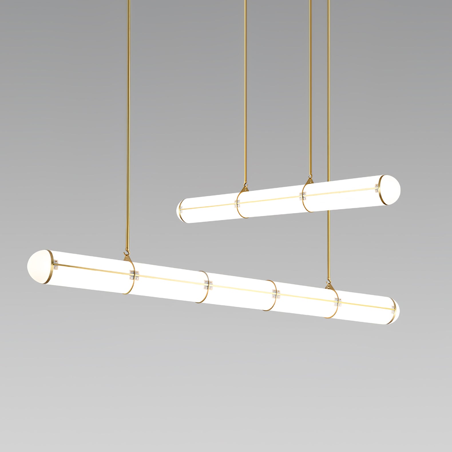 Two Gold cylindrical pendants at varied heights