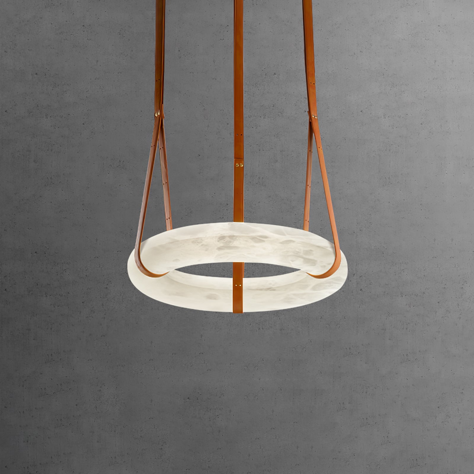 Single horizontal alabaster ring against a grey concrete wall.