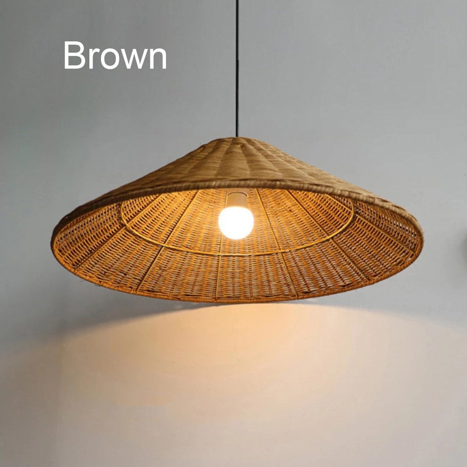 Brown-labelled woven cone shade viewed from below with a central illuminated bulb