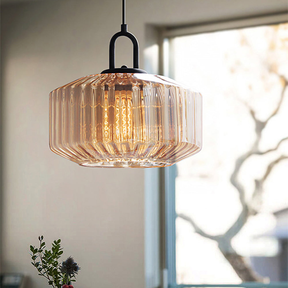 Orange ribbed-glass shade beside a window