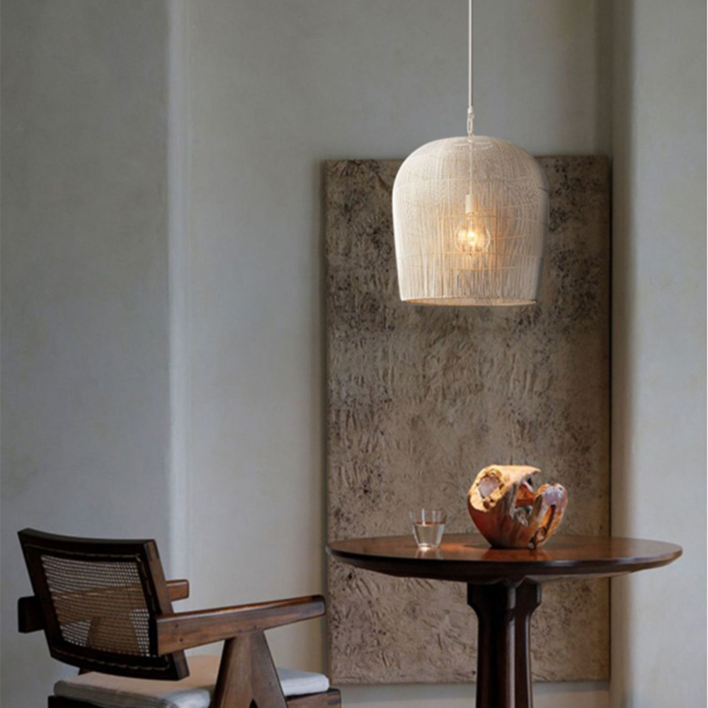 White rattan can pendant above a small round table