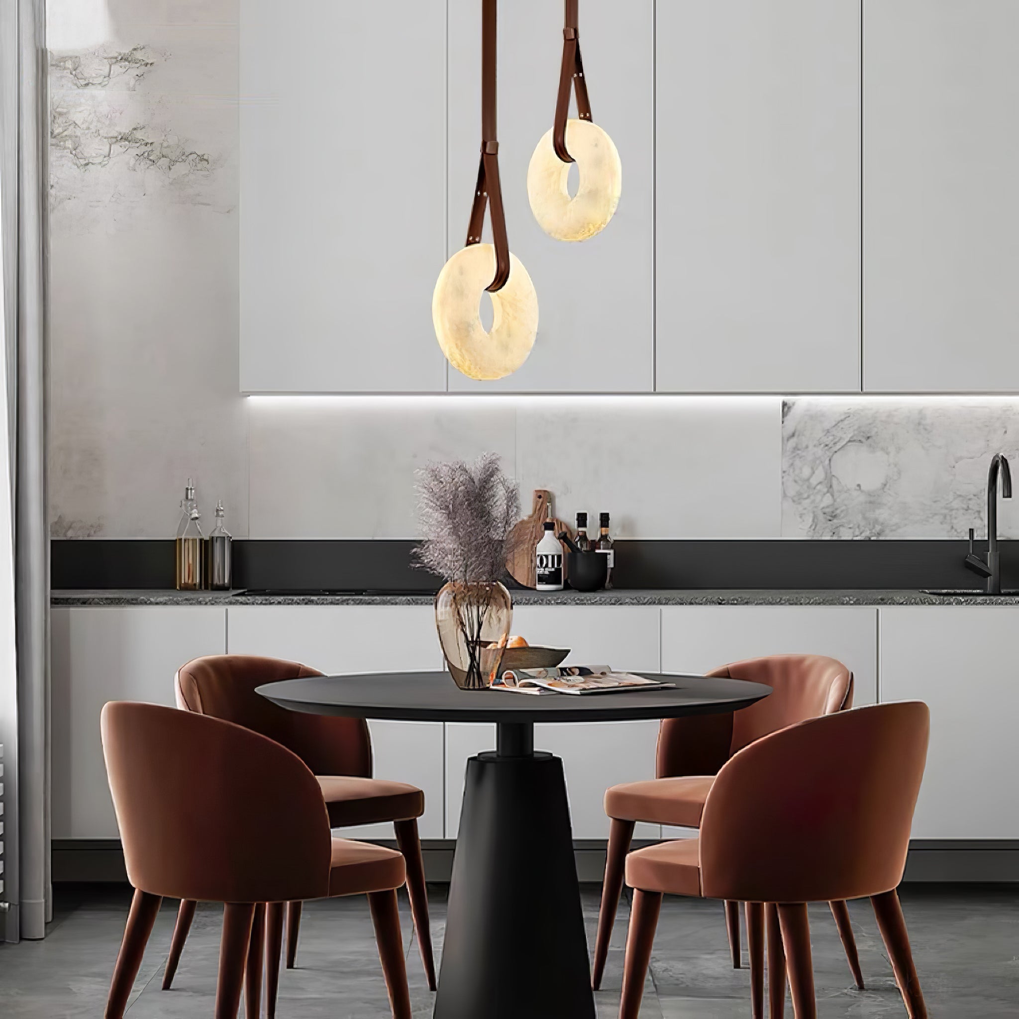Two glowing vertical rings above a round dining table with rust-coloured chairs.