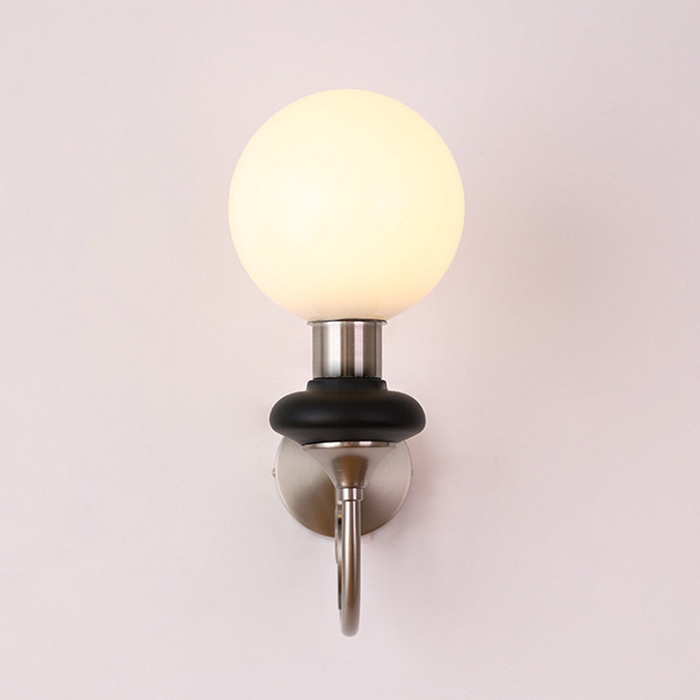 Chrome-and-black globe wall light viewed straight ahead
