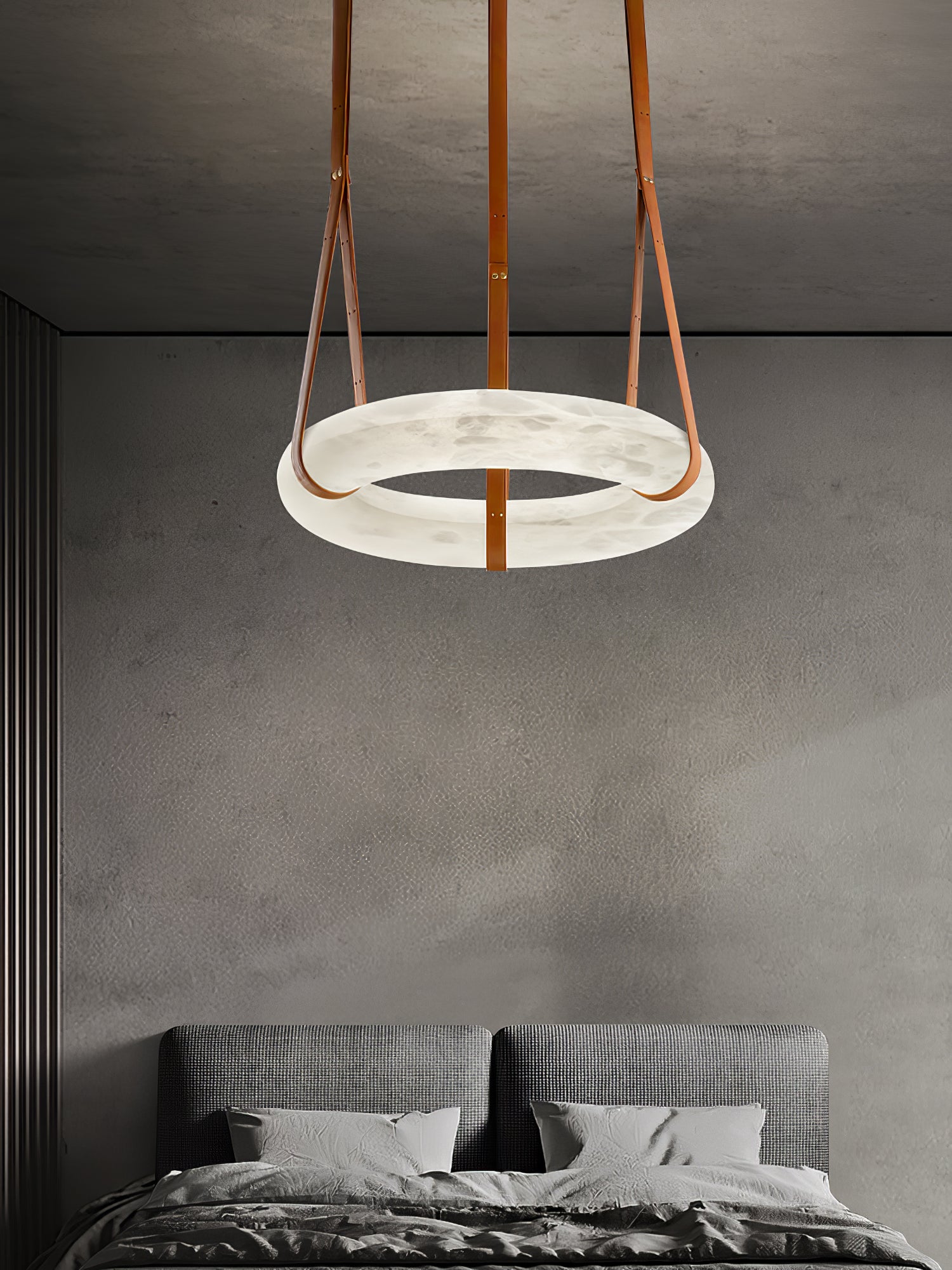 Horizontal ring above a dark bed against a grey bedroom wall.