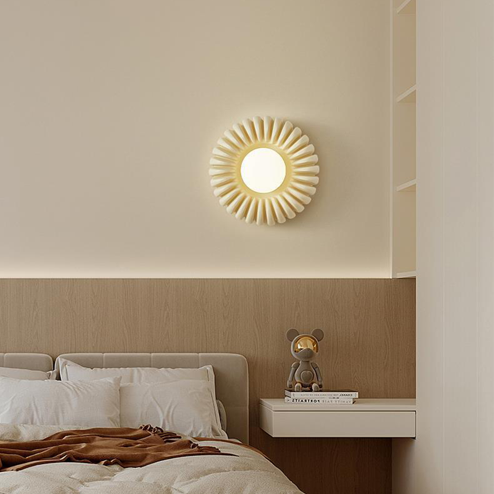 Lit White-centred beige wall light above wood headboard and floating nightstand with books and figurine