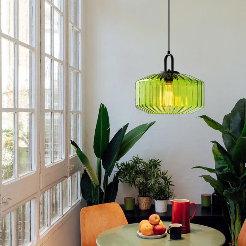 Green glass pendant above a breakfast table and plants