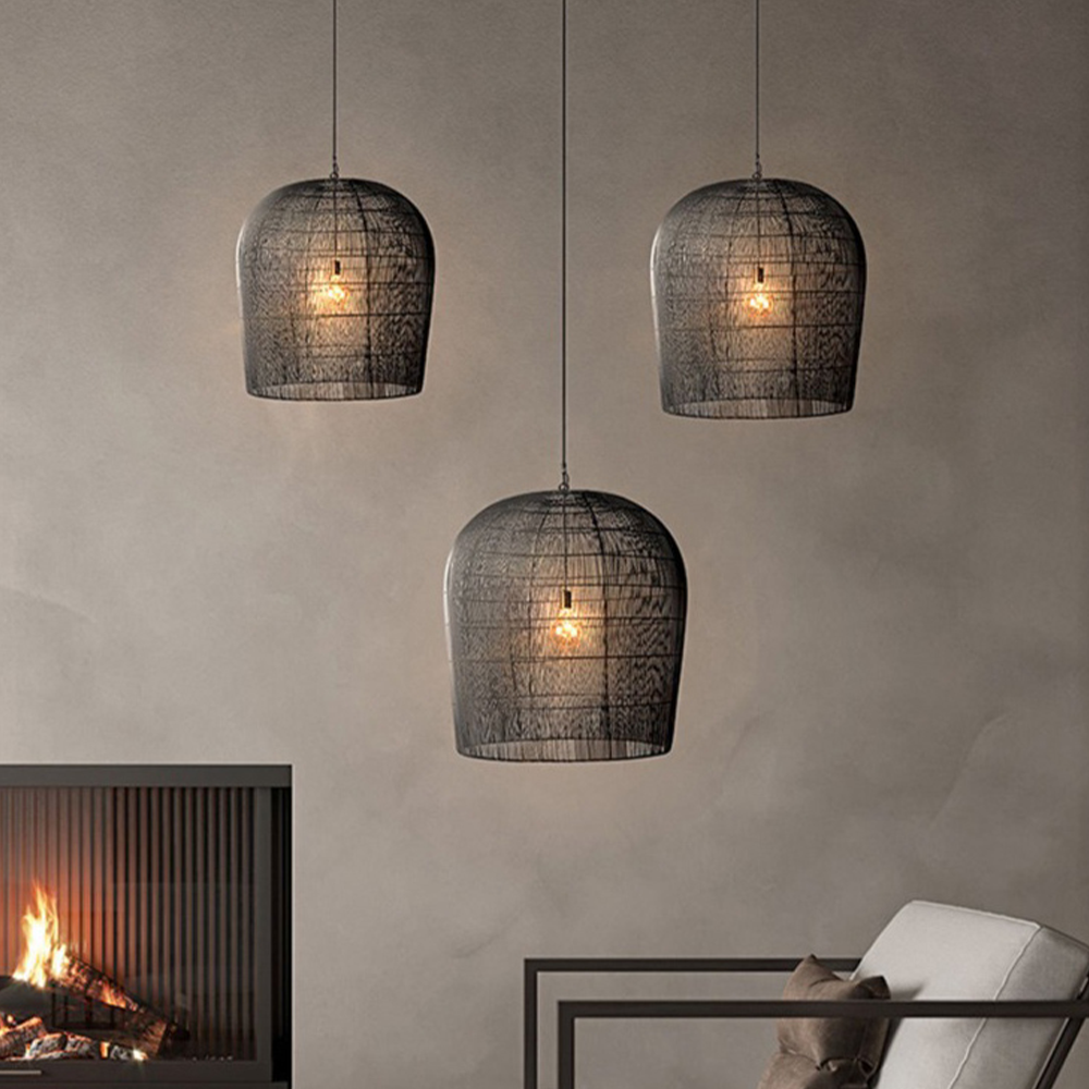 Three separate Black rattan pendants above a seating area