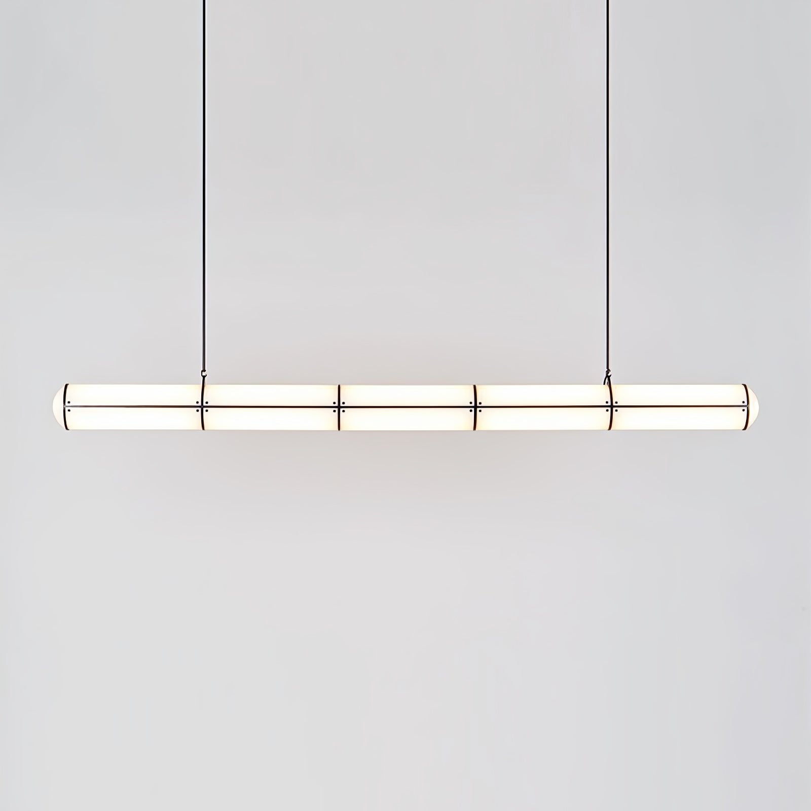 Long cylindrical pendant with spaced metal bands