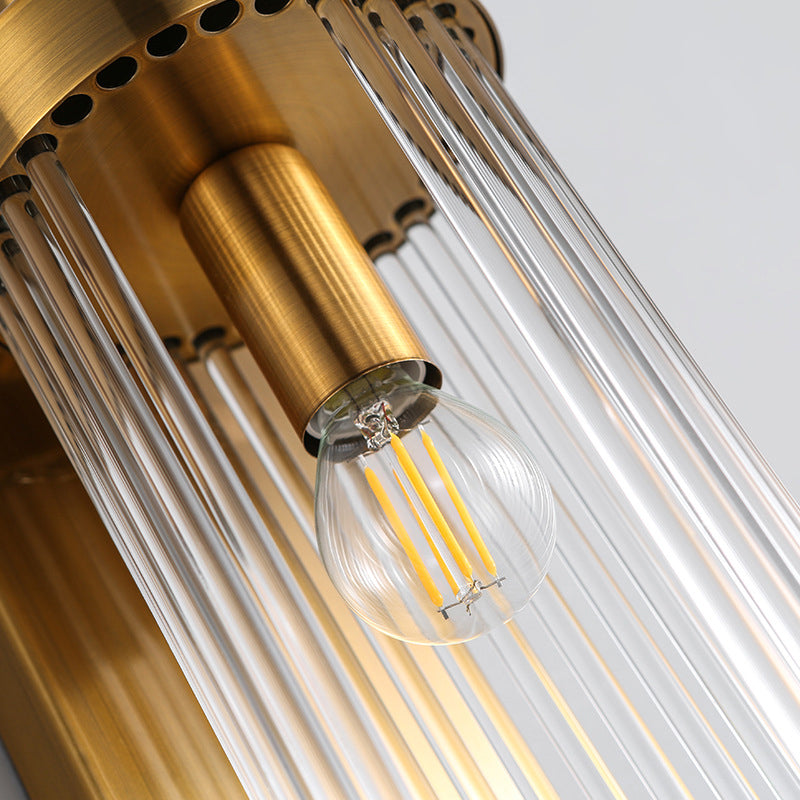 Close view inside a Gold upper cap showing clear rods and a filament-style bulb hanging from the central holder