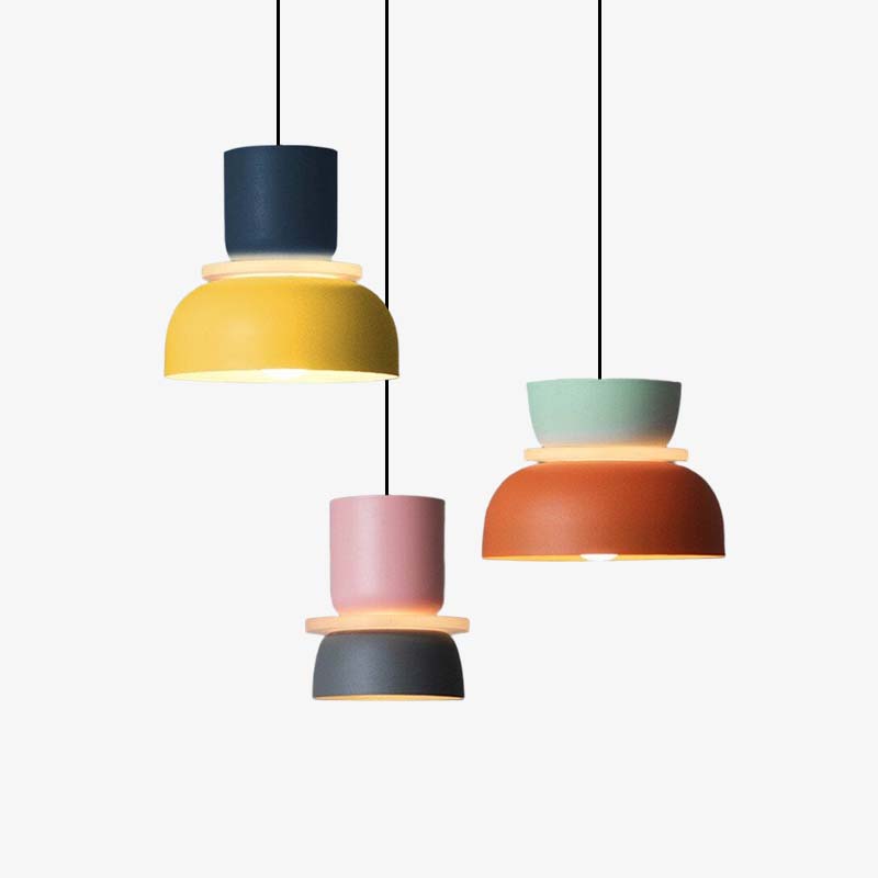 Three mixed-colour cup-and-bowl pendants hanging at different heights against white