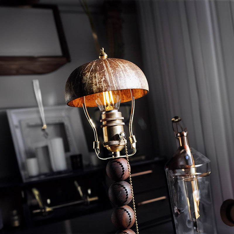 Textured dome shade and exposed gold-toned lamp hardware