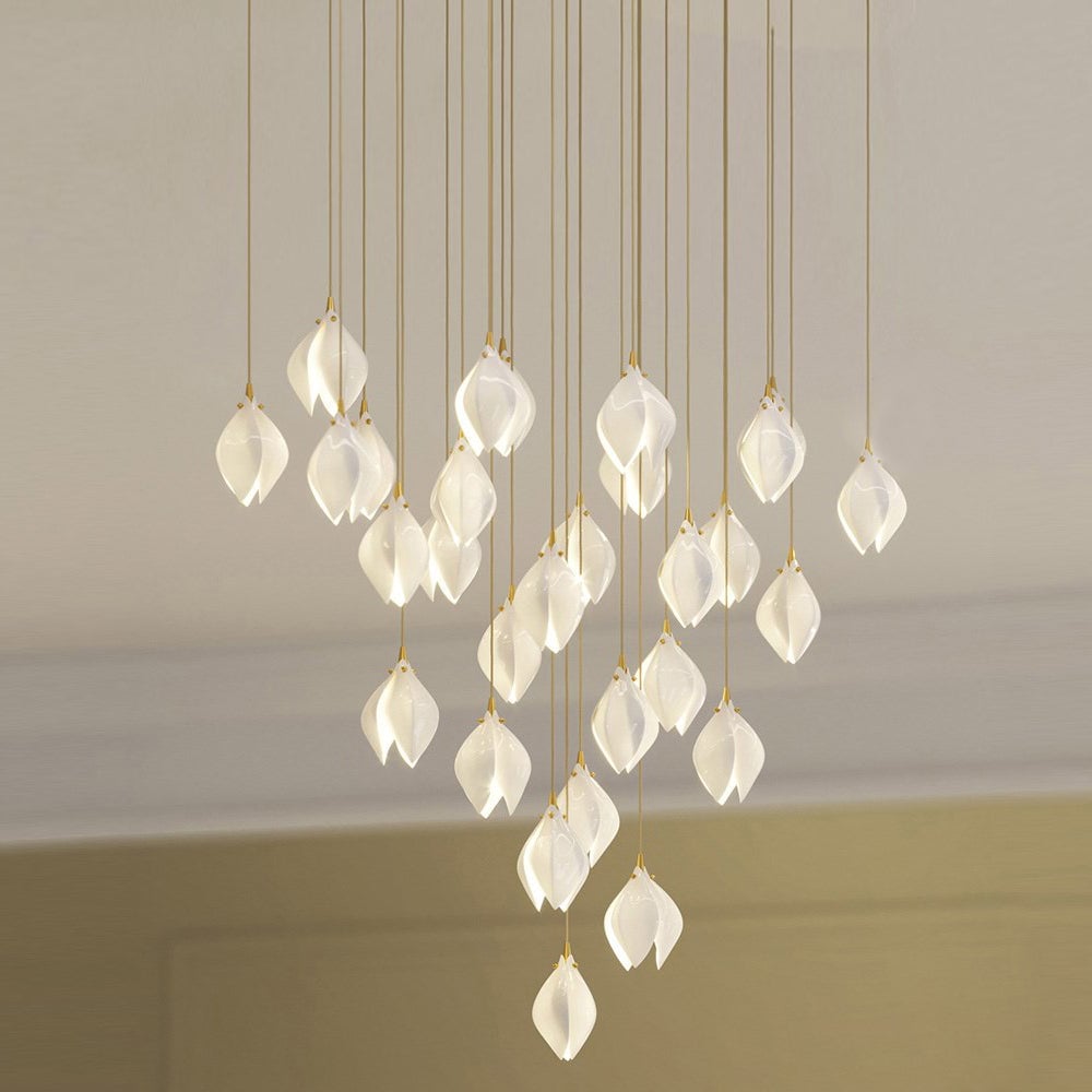 Wide glowing white petal cascade beneath pale ceiling mouldings