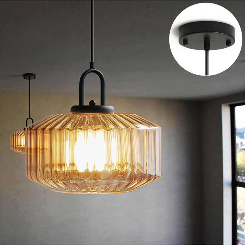 Orange glass pendant with ceiling-canopy detail inset