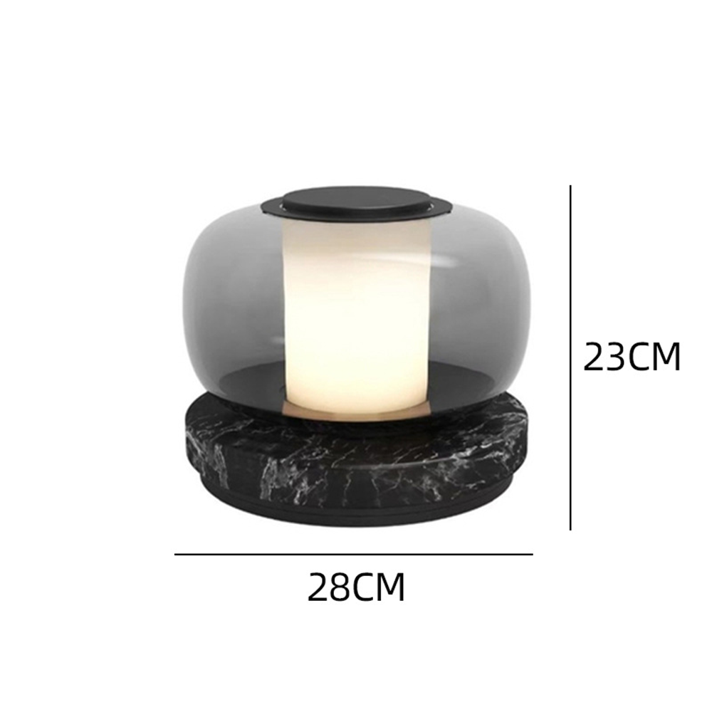 Smoke-grey glass and dark-base table lamp dimension diagram labelled 23 cm overall height and 28 cm width