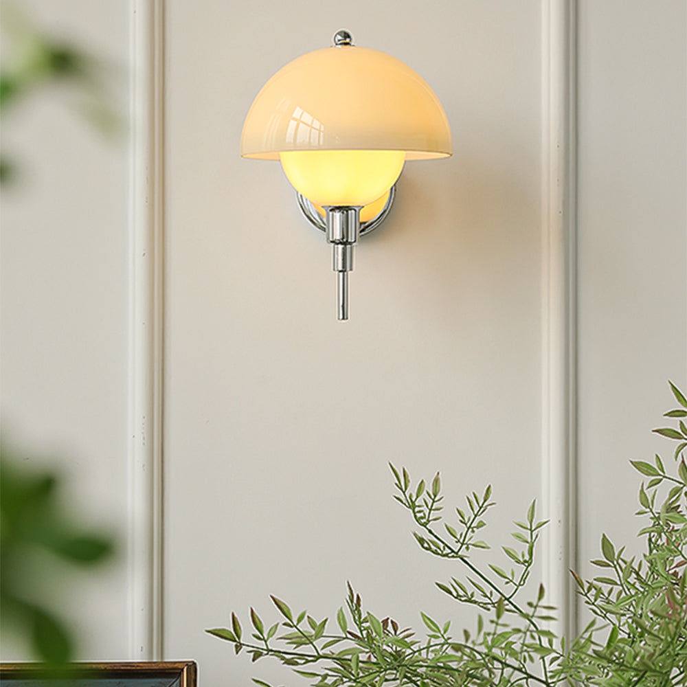 Small Chrome mushroom wall lamp on a pale wall