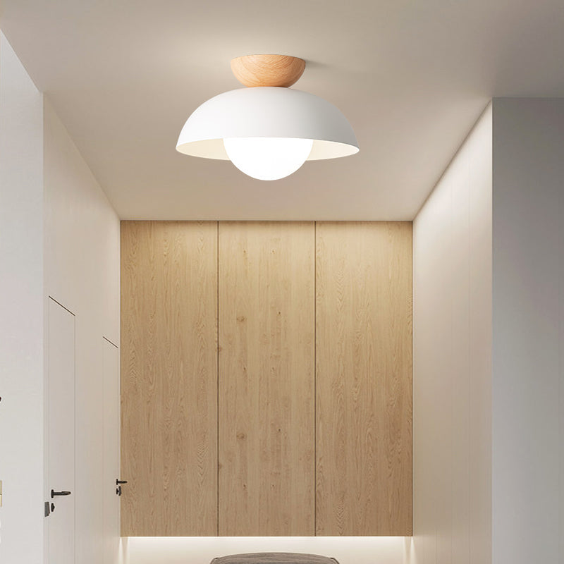 White close-ceiling bowl light with a wood top in a room