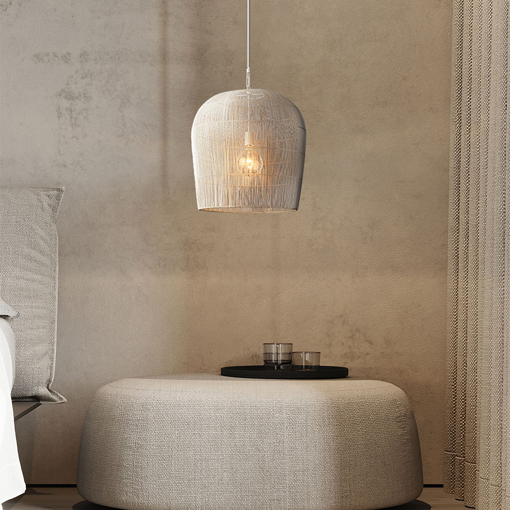 White woven pendant above an upholstered ottoman