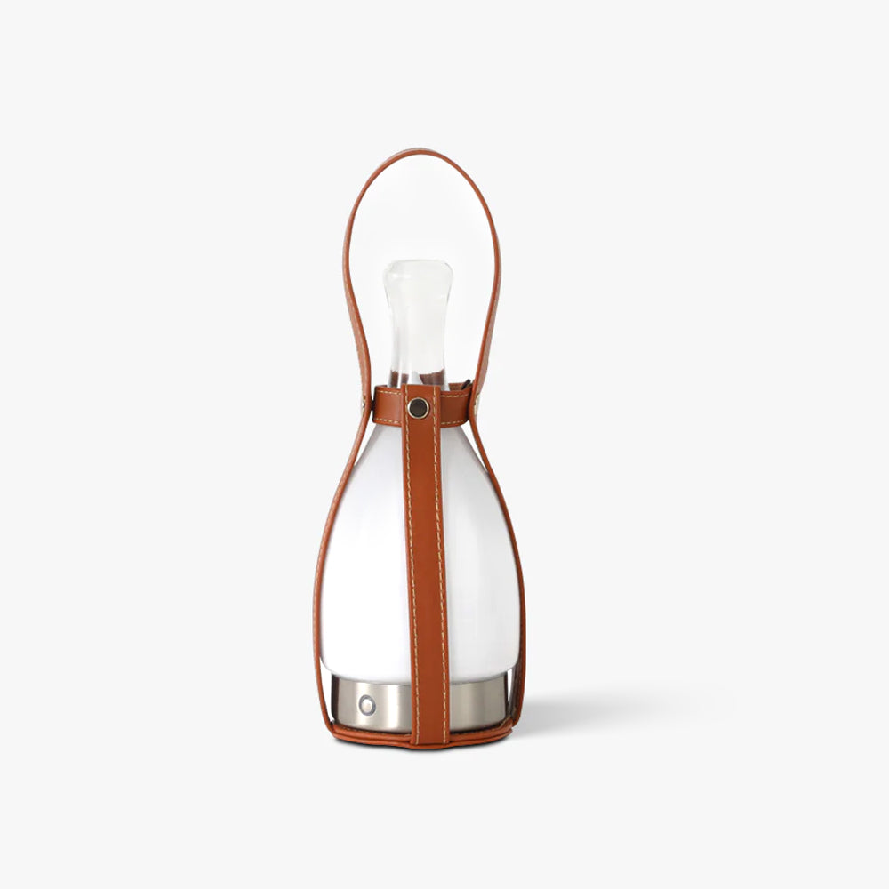 Isolated Bell lamp with pale drop-shaped glass, clear upper neck, brown stitched straps and tall oval handle