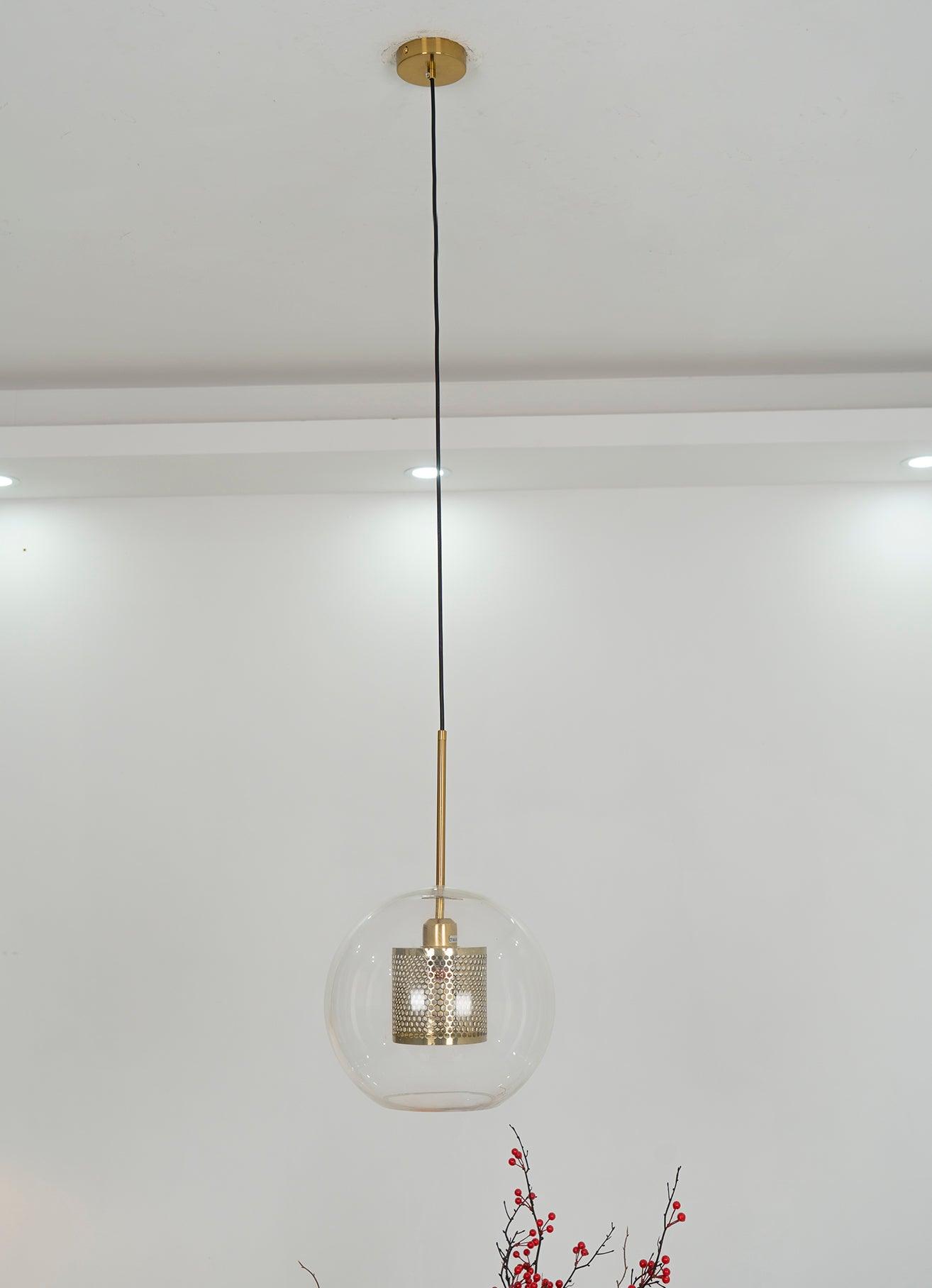 Small glass pendant hanging below a ceiling canopy