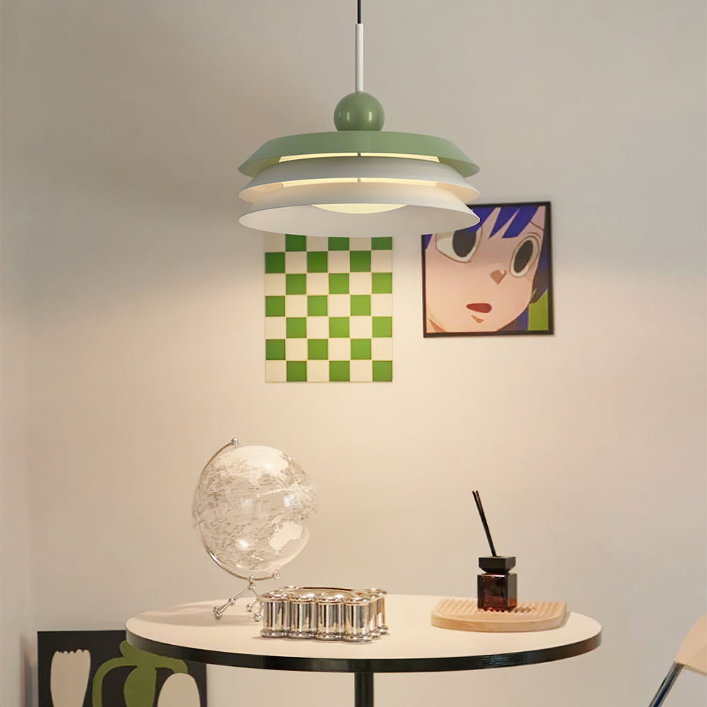 Morandi green-top three-tier pendant with pale lower tiers and green sphere above a small table and globe
