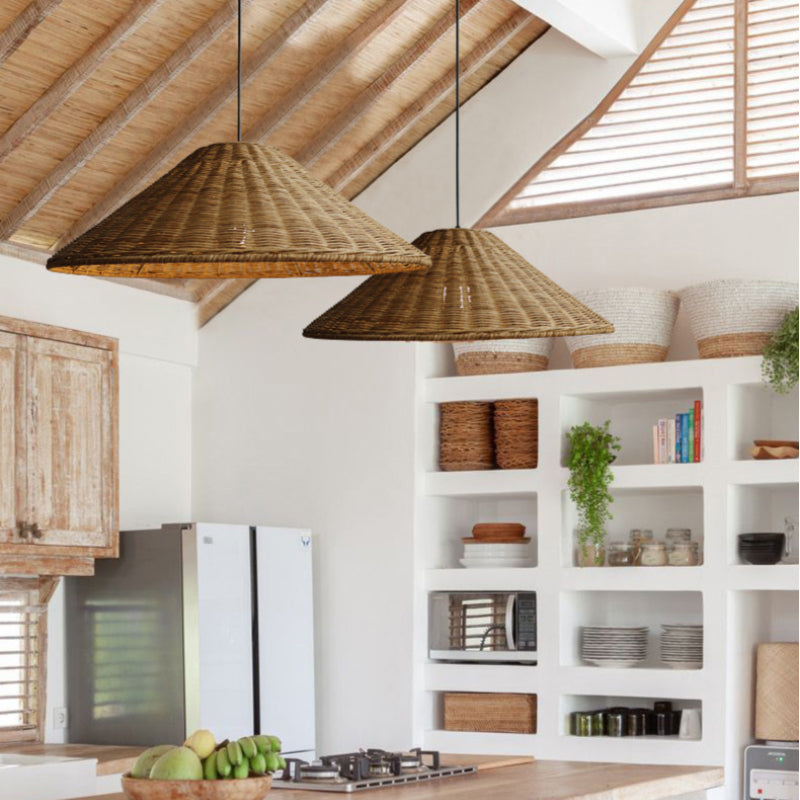 Two Brown rattan cone pendants in a kitchen with open shelves, woven baskets and a pitched wood ceiling