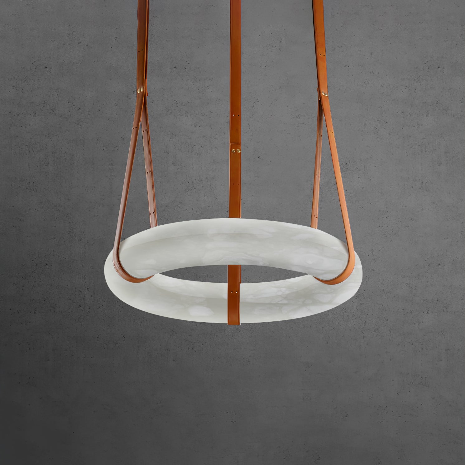 Unlit horizontal ring showing a pale grey alabaster surface and brown straps.