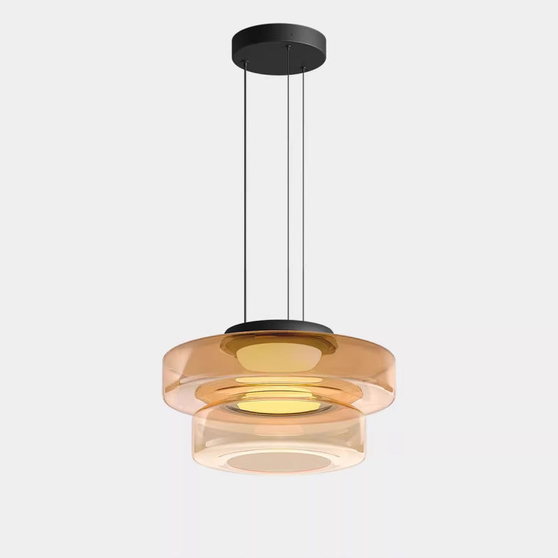 Amber double-tier glass pendant with a black round ceiling canopy and three slender suspension lines